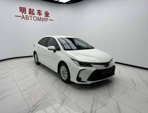 Toyota Corolla 2022 под ключ: TNGA, 1.5L CVT, TSS 2.0, белый седан, 18 000 км, логистика с «ЛАЗУРИТ».
